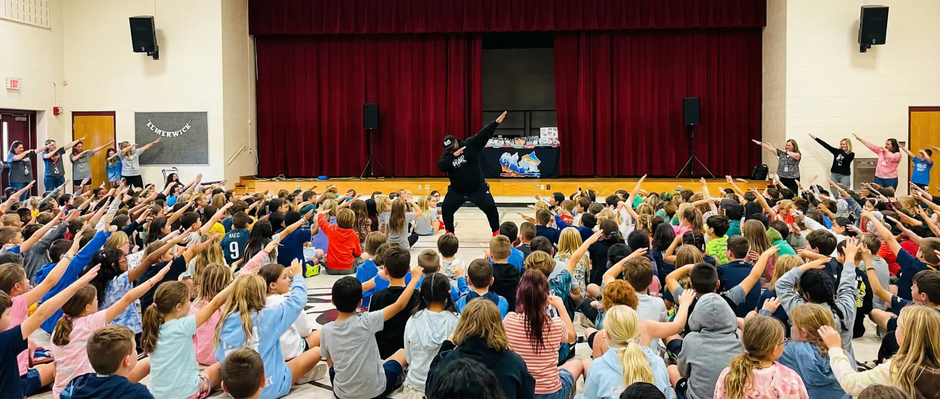 R-E-S-P-E-C-T performer engaging a school audience